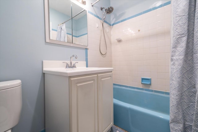 full bath with toilet, shower / bath combo, and vanity