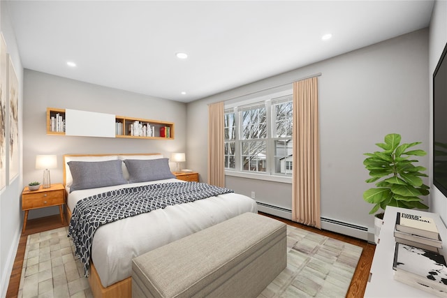 bedroom featuring a baseboard heating unit