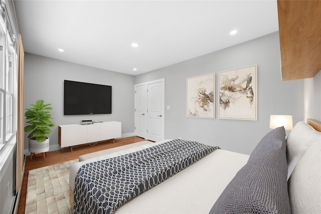 bedroom with wood-type flooring