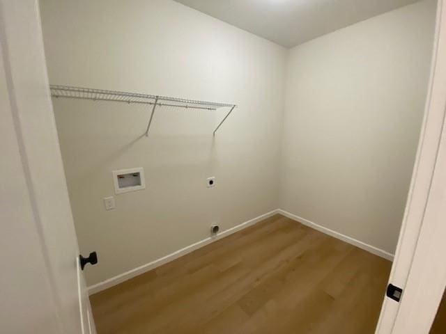 laundry area with hardwood / wood-style flooring, hookup for an electric dryer, and washer hookup