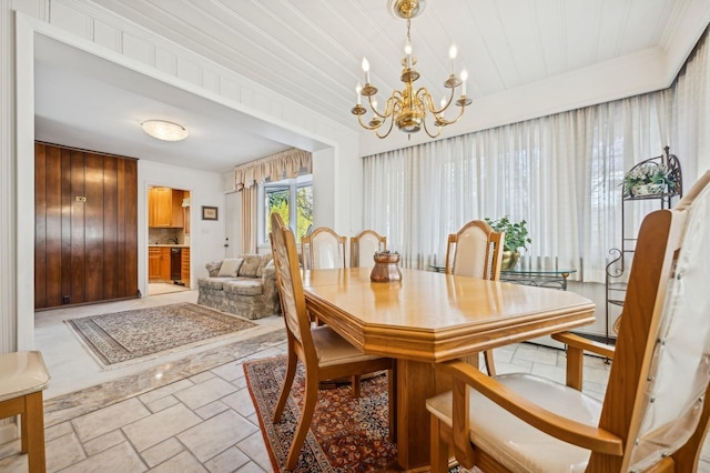 dining space with a chandelier