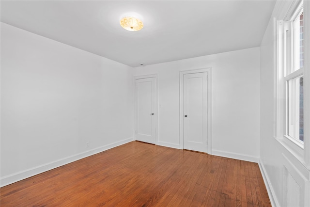 empty room featuring wood-type flooring