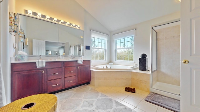 bathroom featuring lofted ceiling, tile patterned flooring, a bath, double vanity, and a stall shower