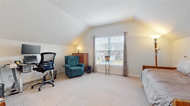 carpeted bedroom with lofted ceiling and baseboards