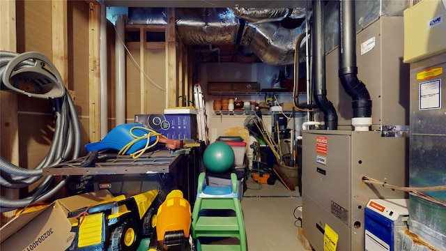 utility room featuring heating unit