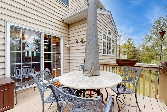 wooden terrace featuring outdoor dining space