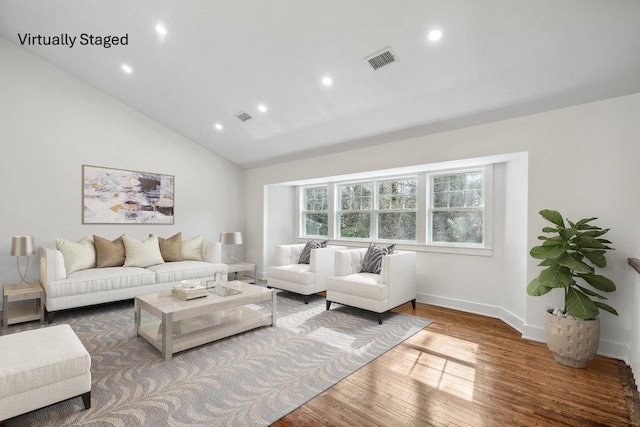 living room featuring vaulted ceiling, wood finished floors, visible vents, and recessed lighting