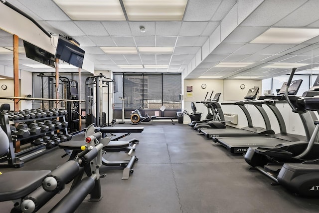 workout area featuring a paneled ceiling