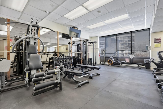 workout area featuring a paneled ceiling