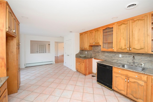 kitchen with black dishwasher, sink, decorative backsplash, baseboard heating, and light stone countertops