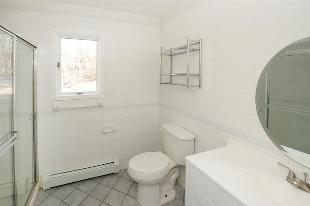 bathroom featuring tile walls, vanity, a baseboard radiator, and toilet