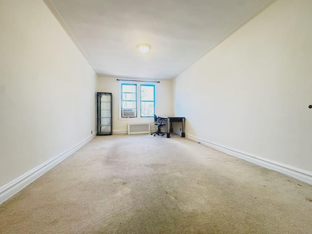 unfurnished office featuring radiator and carpet flooring