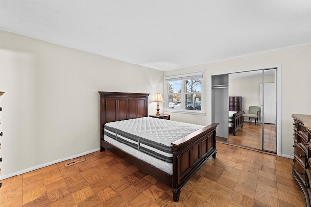 bedroom with visible vents and baseboards