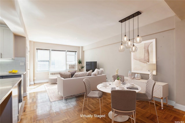 dining room featuring light parquet floors