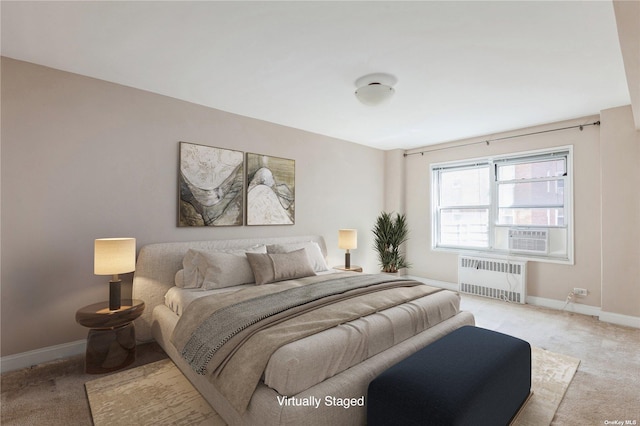 carpeted bedroom with radiator heating unit and cooling unit