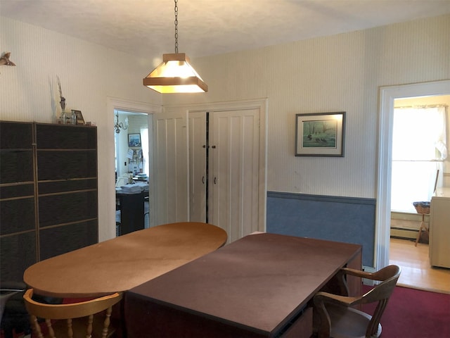 285 Shew Hollow Rd, Call Listing Agent, NY 12093 - dining room with a baseboard heating unit, wallpapered walls, and a wainscoted wall