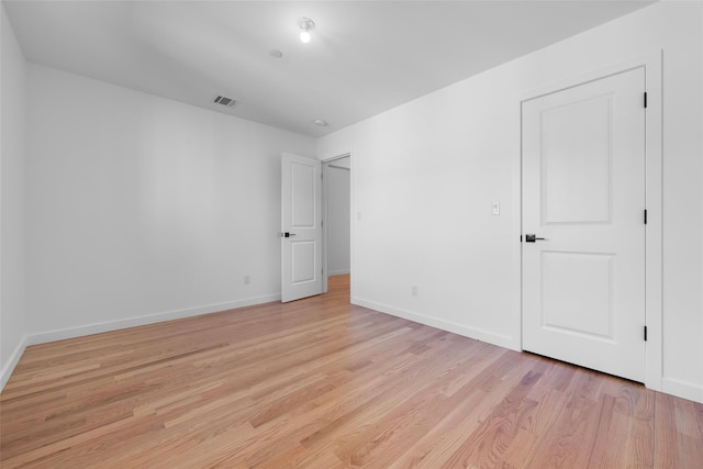 unfurnished bedroom with light wood-type flooring