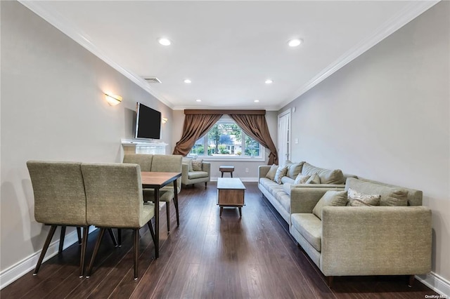 living area featuring baseboards, visible vents, dark wood-style floors, ornamental molding, and recessed lighting