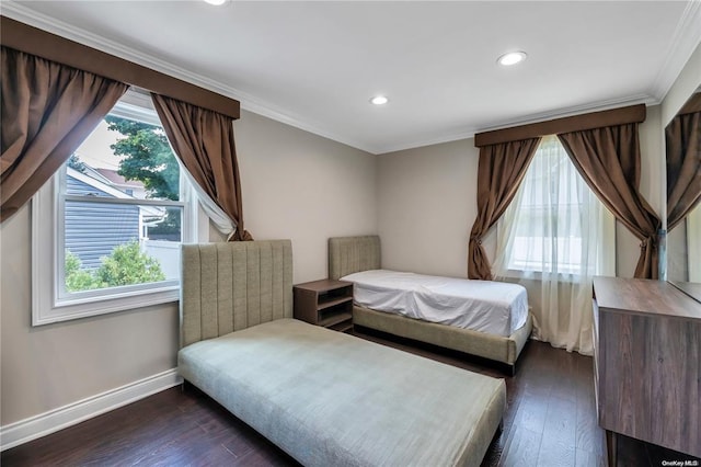 bedroom featuring recessed lighting, baseboards, dark wood finished floors, and ornamental molding