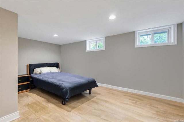 bedroom featuring recessed lighting, light wood finished floors, and baseboards