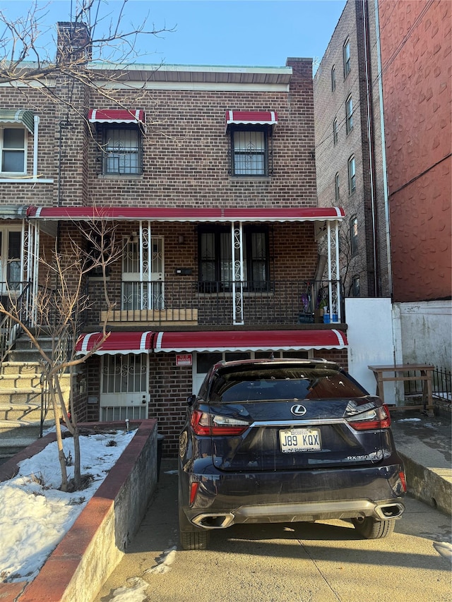 view of property with brick siding