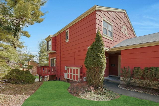 view of home's exterior with a lawn