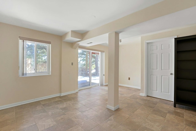 spare room featuring visible vents and baseboards