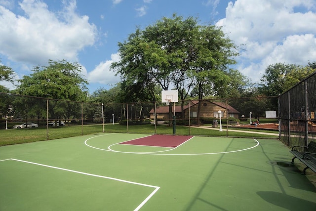 view of sport court featuring community basketball court, a yard, and fence