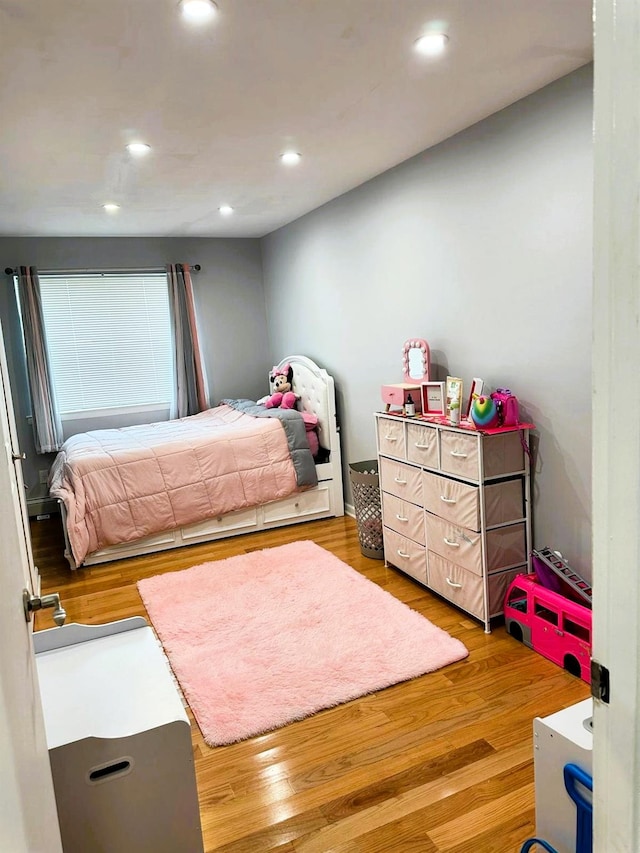 bedroom featuring hardwood / wood-style flooring