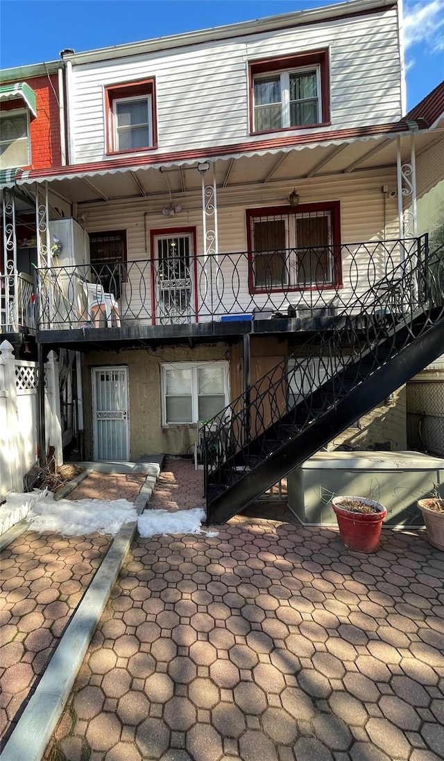 back of house with stairway