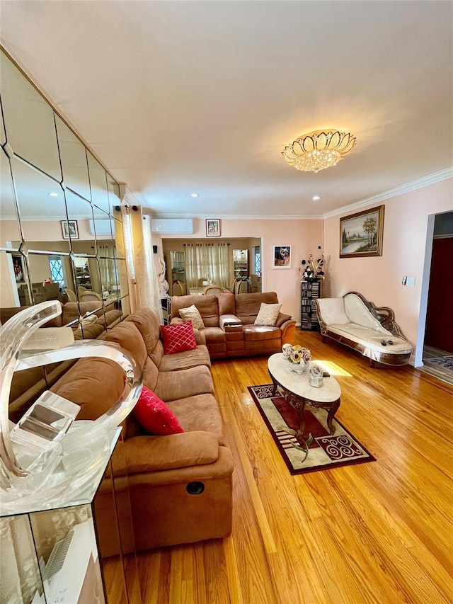 living room with a wall unit AC, crown molding, and wood-type flooring