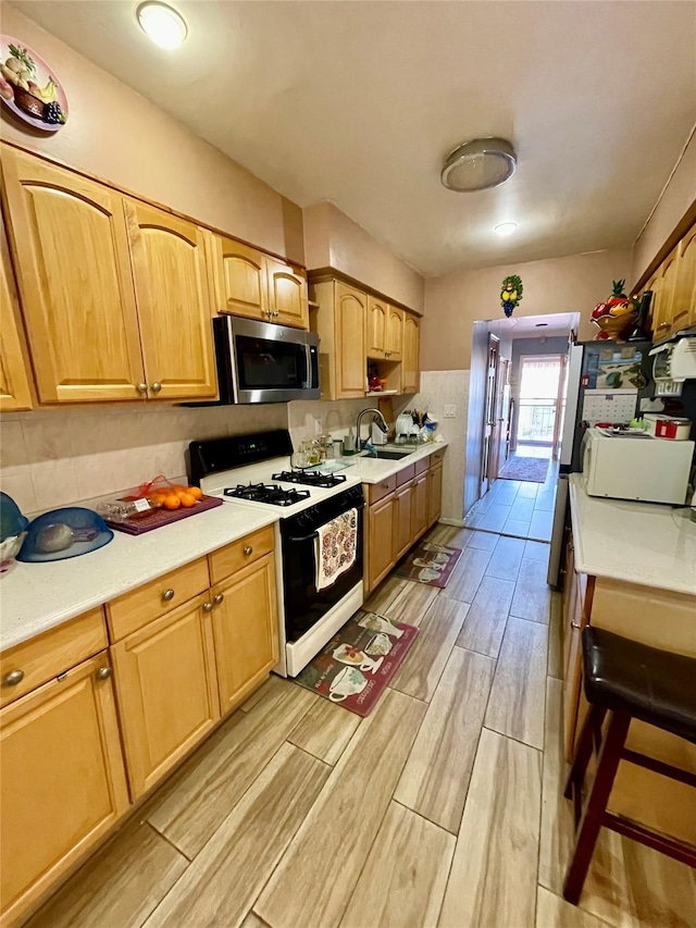 kitchen featuring sink and range with gas stovetop