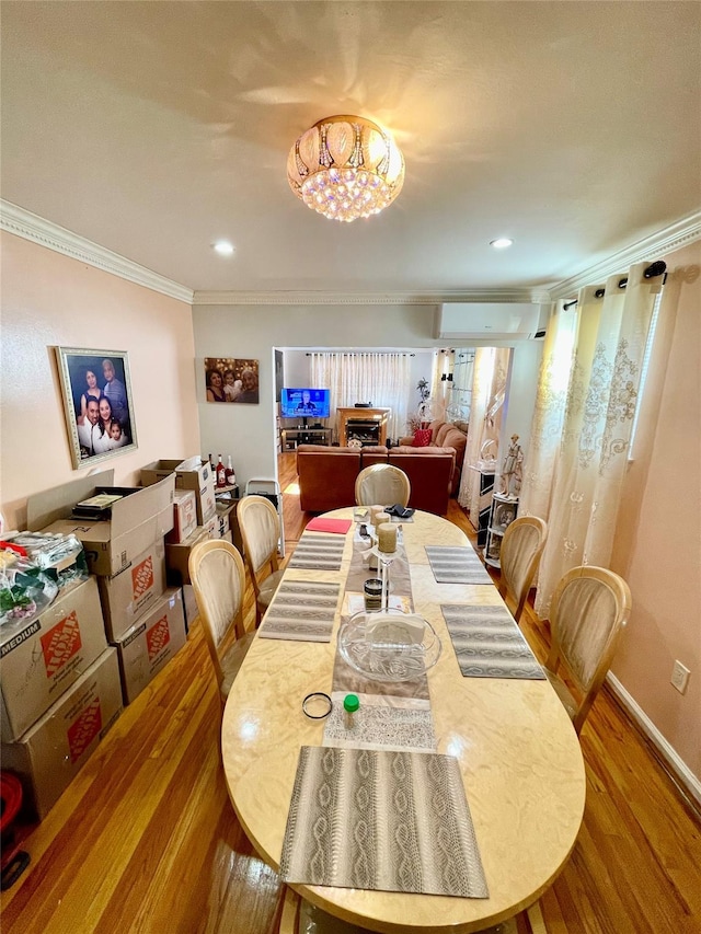 dining room featuring hardwood / wood-style flooring and ornamental molding