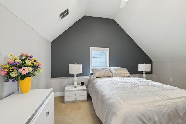 bedroom with light carpet, ceiling fan, vaulted ceiling, and visible vents