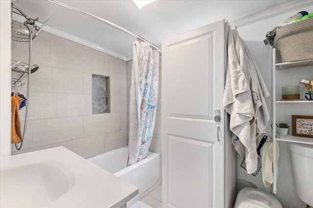 full bathroom with a sink, toilet, and shower / bath combo with shower curtain