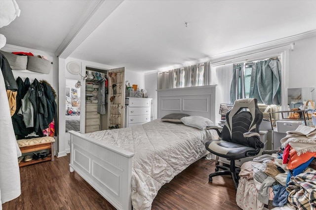 bedroom with dark wood-style flooring and crown molding