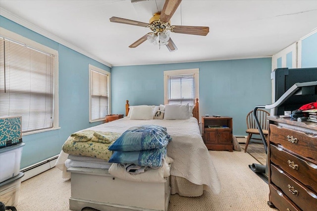 carpeted bedroom with a ceiling fan, a baseboard radiator, and crown molding