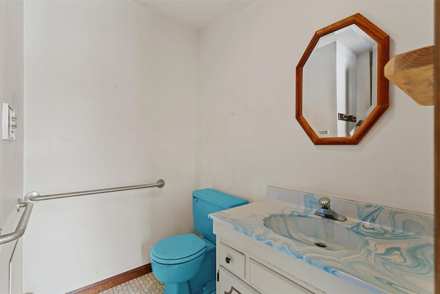 bathroom with toilet and vanity