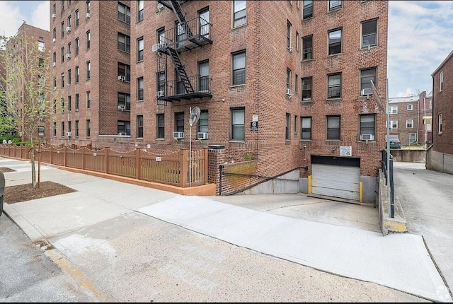 view of building exterior featuring fence