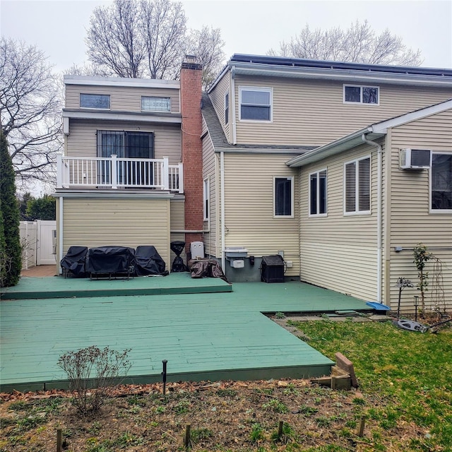 554 Grant Ave, West Hempstead, NY 11552 - rear view of property featuring a balcony and a chimney