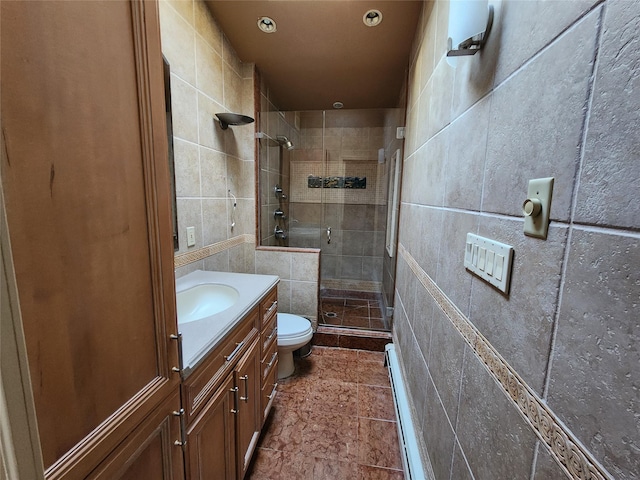 bathroom featuring toilet, tile walls, walk in shower, and vanity