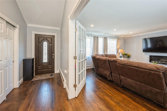 foyer with recessed lighting, dark wood-style flooring, crown molding, and baseboards