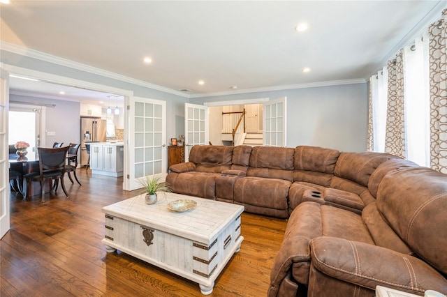 living room featuring dark wood-style floors, recessed lighting, ornamental molding, and stairway