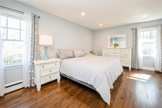 bedroom with dark wood-style floors, baseboards, and recessed lighting