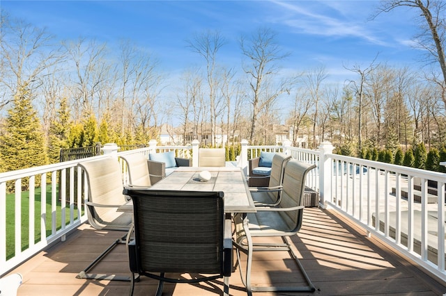 wooden terrace with outdoor dining area