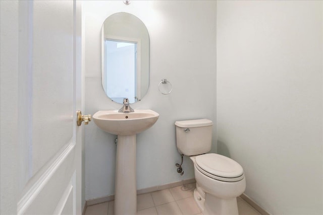 bathroom featuring tile patterned floors and toilet