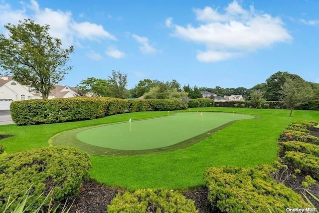 view of property's community with a lawn