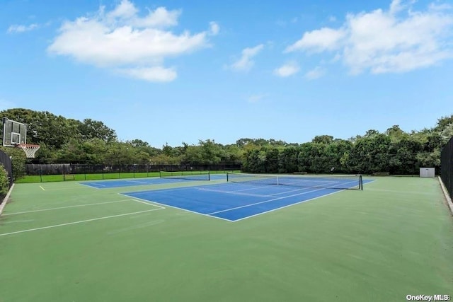 view of tennis court featuring basketball court