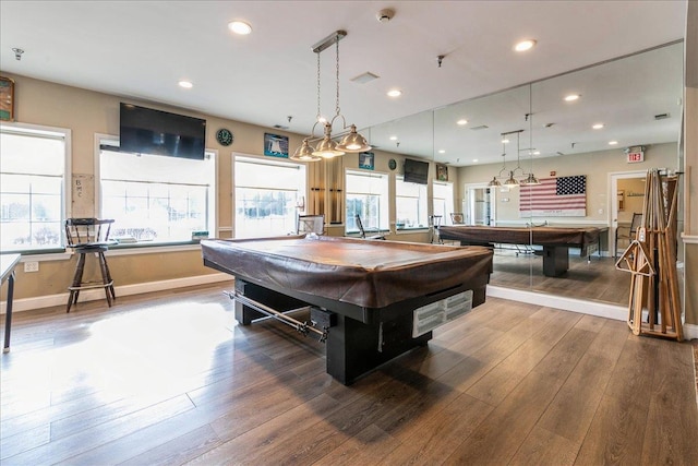 rec room with pool table, wood-type flooring, and plenty of natural light