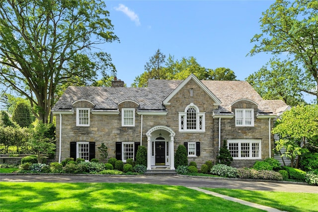 133AKA139 Hampshire Rd, Bronxville, NY 10708 - view of front of property with a high end roof, stone siding, and a chimney